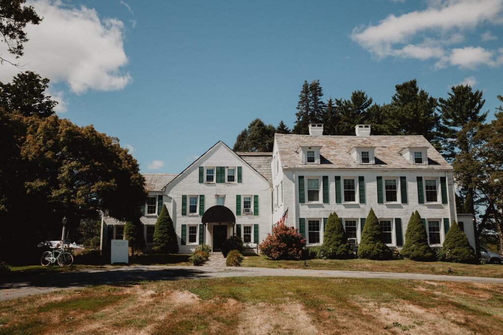 Discover Kirsten + Charlie’s romantic August wedding at Gwyn Careg Inn. Elegant details, lush florals, and timeless photography.