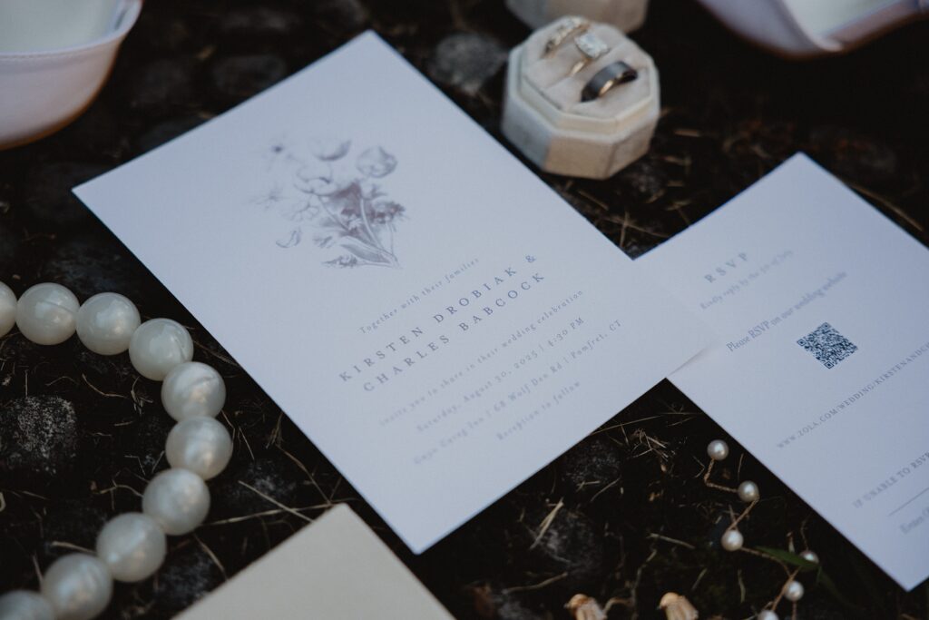 Discover Kirsten + Charlie’s romantic August wedding at Gwyn Careg Inn. Elegant details, lush florals, and timeless photography.