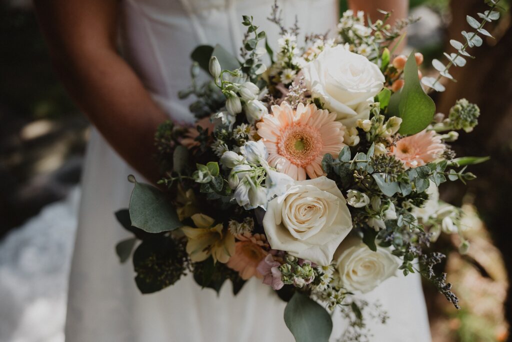 Discover Kirsten + Charlie’s romantic August wedding at Gwyn Careg Inn. Elegant details, lush florals, and timeless photography.