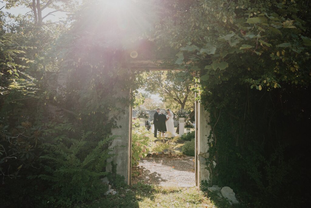 Discover Kirsten + Charlie’s romantic August wedding at Gwyn Careg Inn. Elegant details, lush florals, and timeless photography.