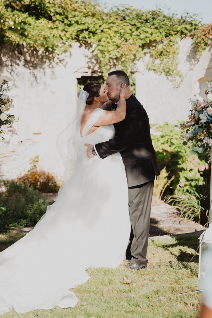 Discover Kirsten + Charlie’s romantic August wedding at Gwyn Careg Inn. Elegant details, lush florals, and timeless photography.