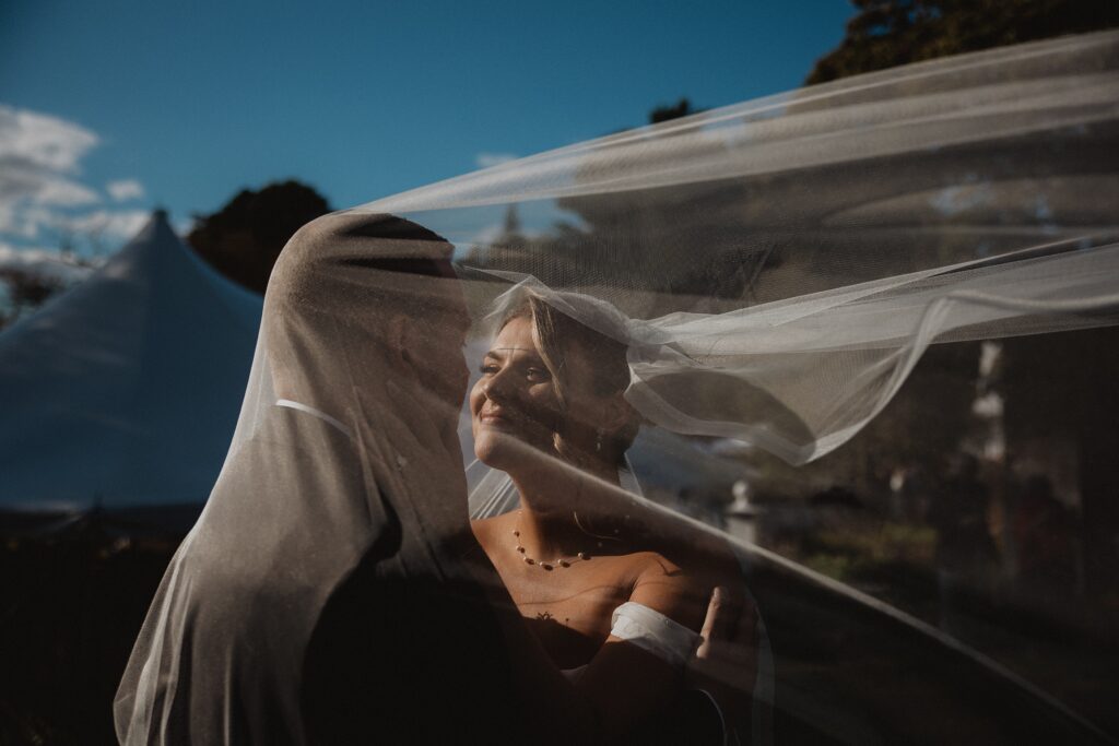 Discover Kirsten + Charlie’s romantic August wedding at Gwyn Careg Inn. Elegant details, lush florals, and timeless photography.