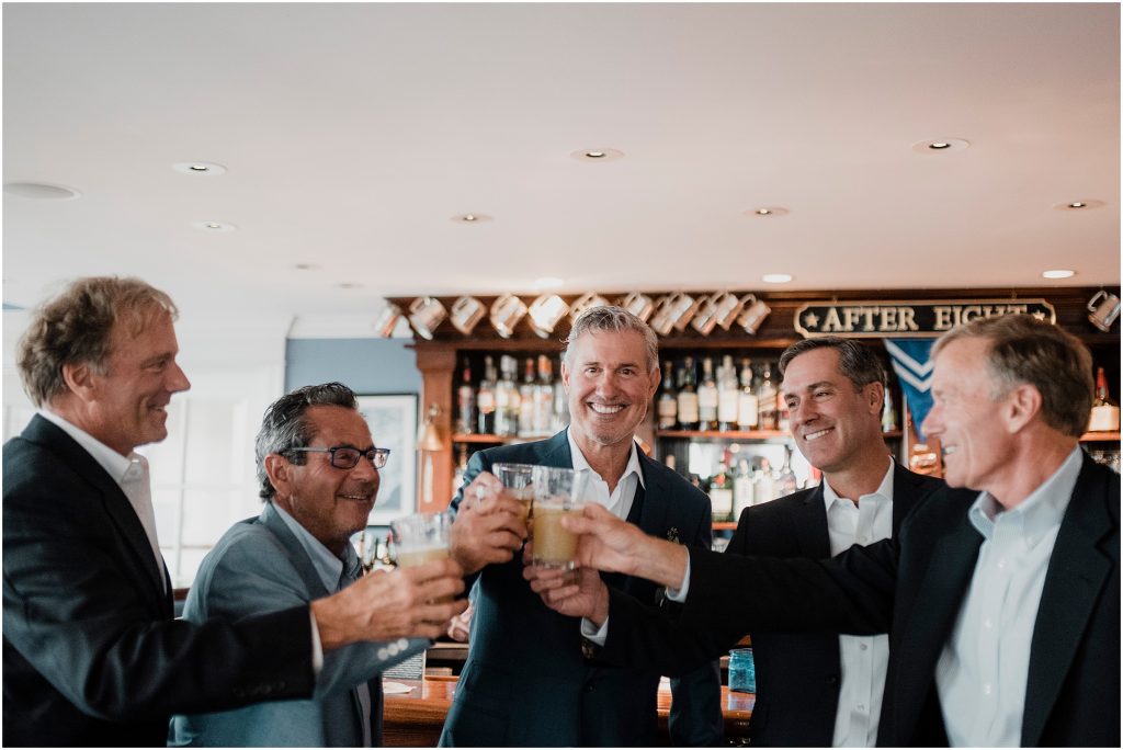 Groomsmen cheers to his last morning single before his wedding ceremony in Watch Hill, Rhode Island | Love, Sunday Photography