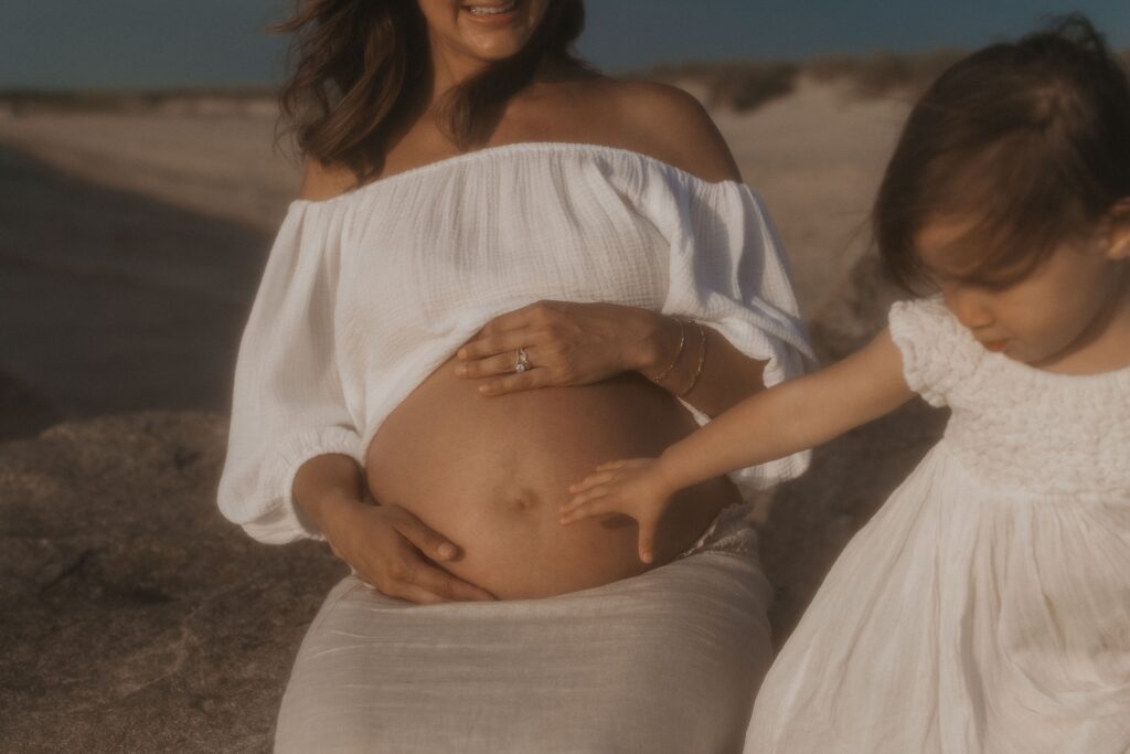 Trendy Cape Cod Maternity Photos on the Beach at Sunset